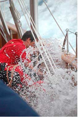 Photo of water splashing on a sailor